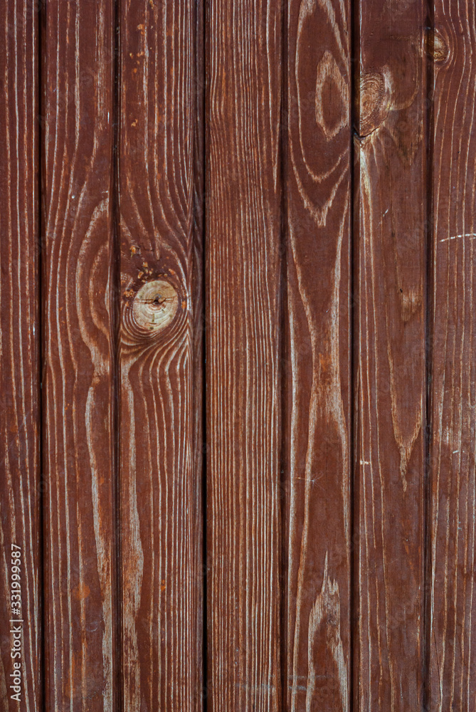 Naklejka premium Shabby old red-brown fence, wooden plank background, rustic, grunge, old fashion