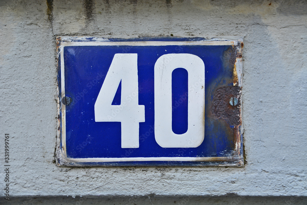 A house number plaque, showing the number fourty (40)