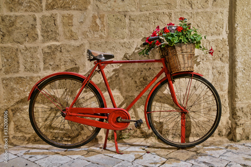 Old vintage bicycle with flowers in Puglia region in Italy © Jakub