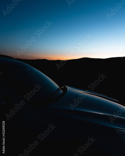 silhouette of car at sunset