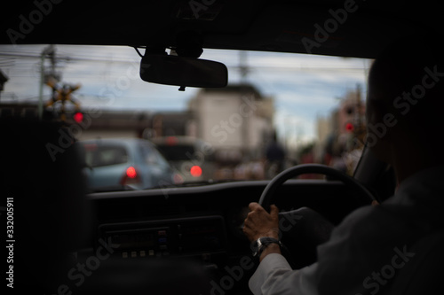 man driving a car/taxi