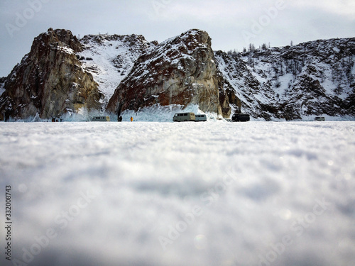 Tough rocks of Olkhon Island near Cape Khoboy by winter, Baikal Lake, Russia photo