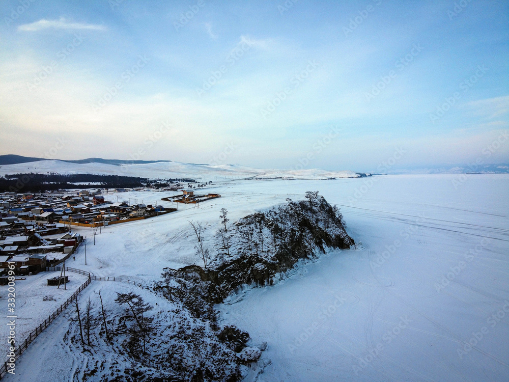 Khuzhir village aerial view by winter, Olkhon Island, frozen Baikal Lake, Russia