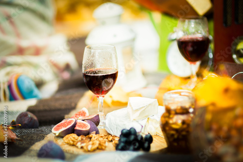 Detail of figs, grapes,cheese, walnuts, vine