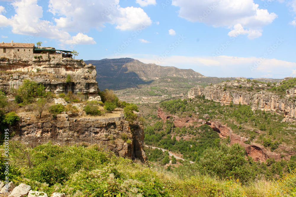 Panoramic landscape from a cliff at Siurana - a famous highland village Siurana of the municipality of the Cornudella de Montsant in the comarca of Priorat, Tarragona, Catalonia, Spain.