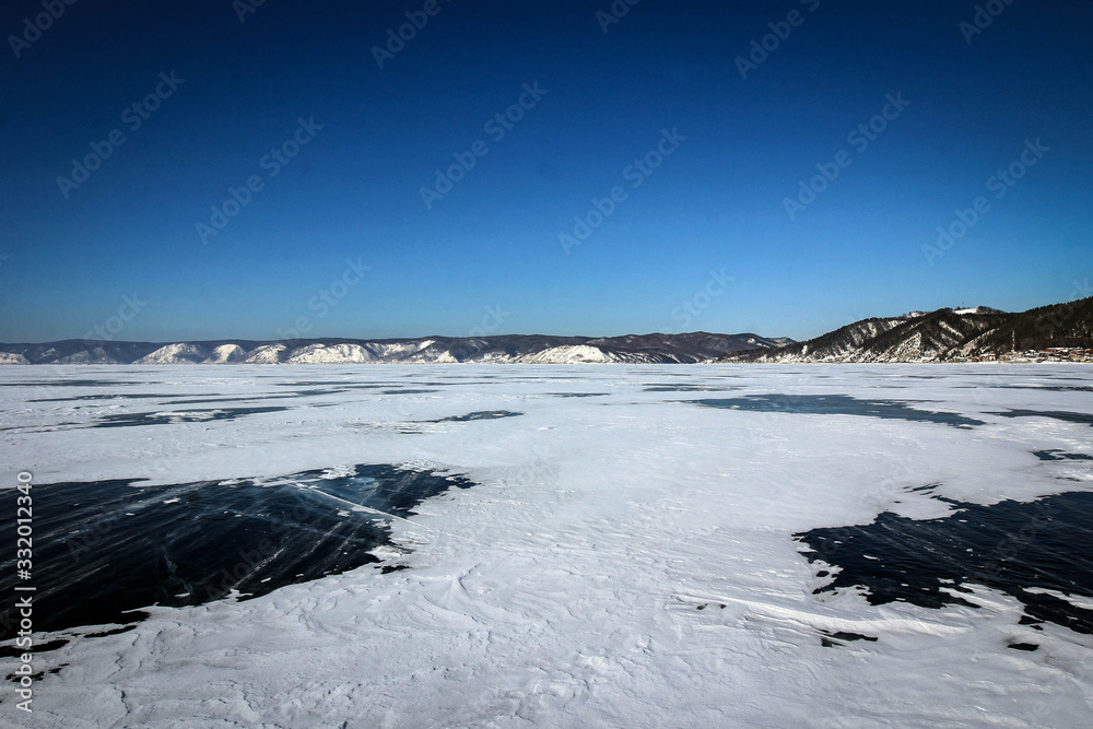 View of frozen Baikal Lake covered by snow, Russia