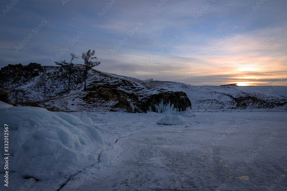 Frozen rocks of Olkhon Island view by winter, Baikal Lake, Russia Frozen rocks of Olkhon Island view by winter, Baikal Lake, Russia