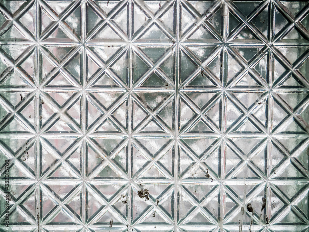 Glass of the squares pattern of an abandoned building Glass of the squares pattern of an abandoned building