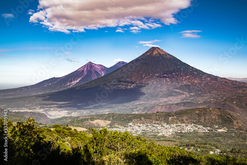 View of Volcan de Agua and Acatenango from the slopes of Pacaya volcano near Antigua in Guatemala, Central America. Volcanic daytime landscape of Central Guatemala. photo