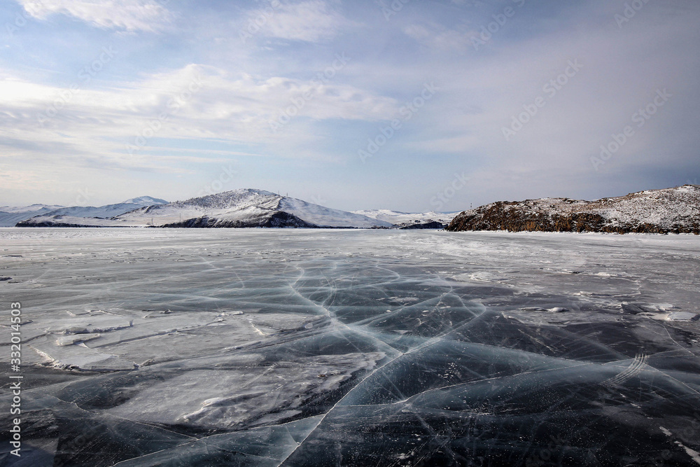 Pure ice of frozen Baikal Lake view near Olkhon Island, Russia