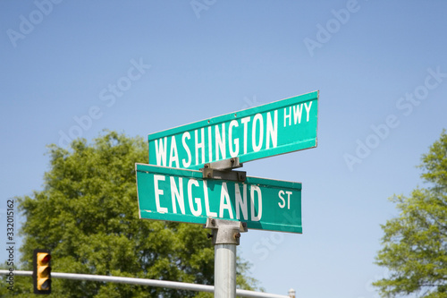 Street signs at an intersection that read England St. and Washington Hwy off Route 1 in Virginia south of Washington, DC, symbolizing the Special Relationship that exists between England and America