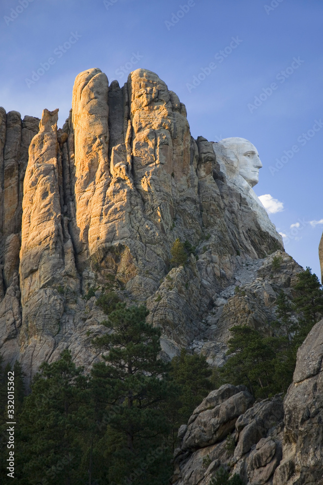 A profile at sunset of George Washington at Mount Rushmore National Memorial, South Dakota