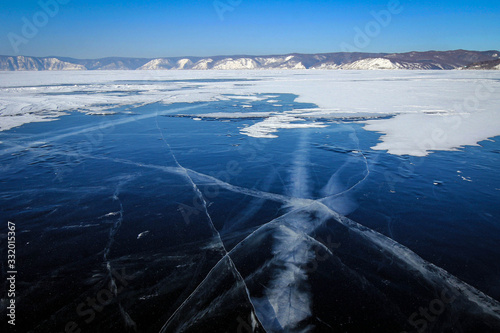 Scenic view of frozen Baikal Lake covered by snow near Listvyanka village  Russia