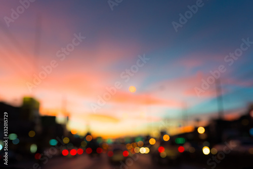 Blur traffic jam with sunset sky background.