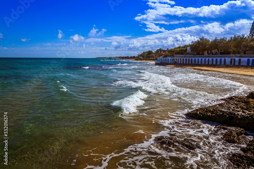 Spiaggia sul Mediterraneo in inverno con mare agitato  photo