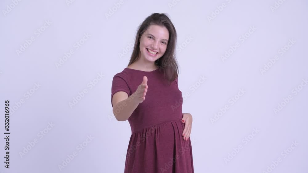 Happy young beautiful pregnant woman giving handshake Happy young beautiful pregnant woman giving handshake