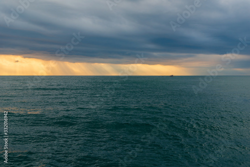 Vivid sunset over the Black Sea with stormy clouds
