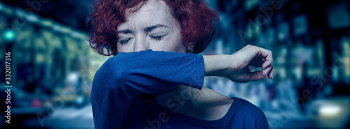 Coronavirus prevention, COVID-19 pandemic protection banner. Woman in city street sneezing, coughing into sleeve or elbow for stop spreading virus disease. Preventive for reducing risk of infection.