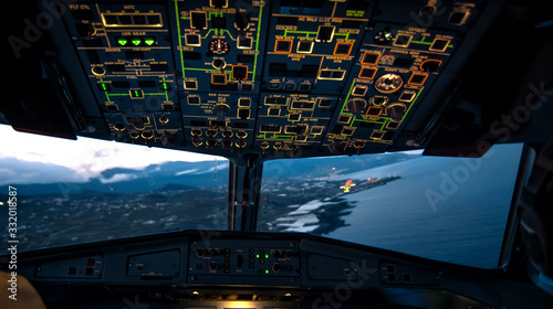 Airliner approaching the airport to land, cockpit view