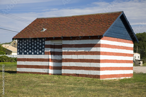 Building with mural painting of the American flag along old Lincoln Highway, US 30, Ogallala, Nebraska photo