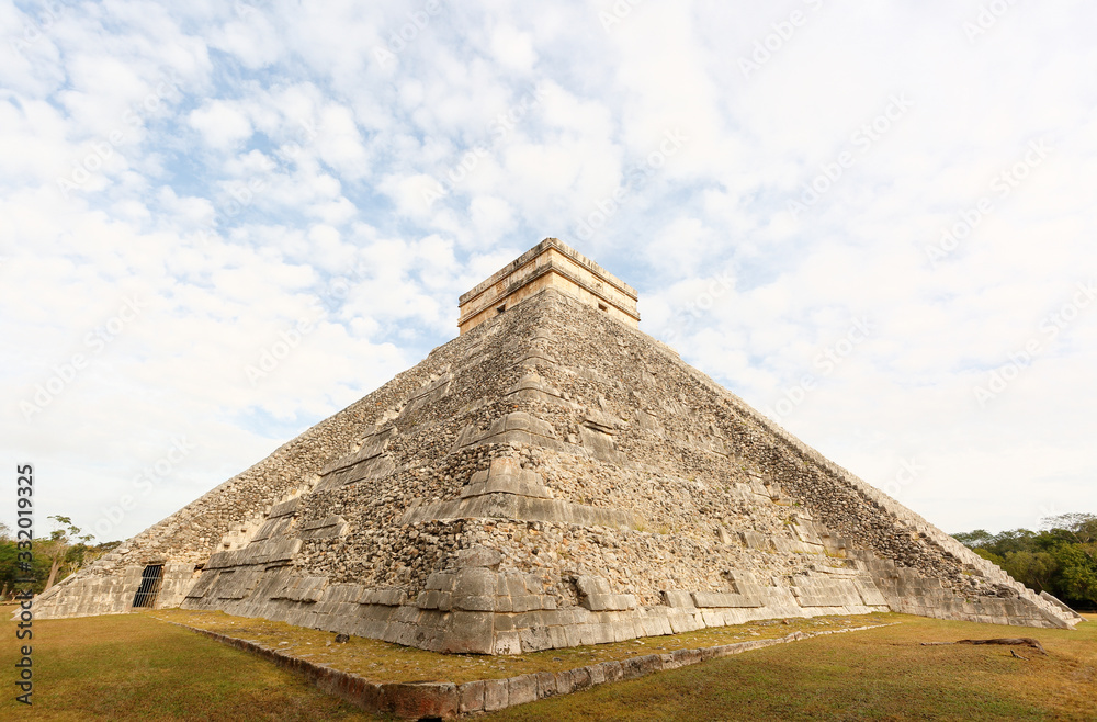 Chichen Itza is a world-famous complex of Mayan ruins on Mexico's Yucatan Peninsula. Photo Shows A massive step pyramid known as El Castillo. Chichen Itza is a world-famous complex of Mayan ruins on Mexico's Yucatan Peninsula. Photo Shows A massive step pyramid known as El Castillo.