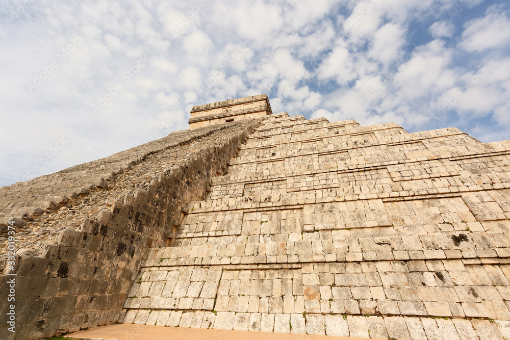 Chichen Itza is a world-famous complex of Mayan ruins on Mexico's Yucatan Peninsula. Photo Shows A massive step pyramid known as El Castillo.