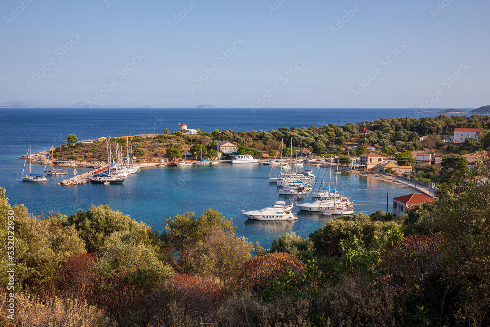 Port of Kastos island with moored yachts, sailboats, boats - Ionian sea, Greece in summer.