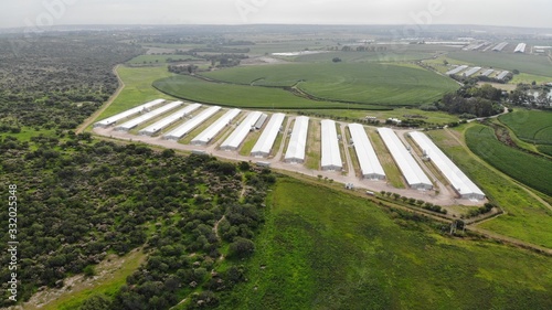 created by dji camera, aerial shot of chicken farms, breeding. Chicken industry, industrial buildings