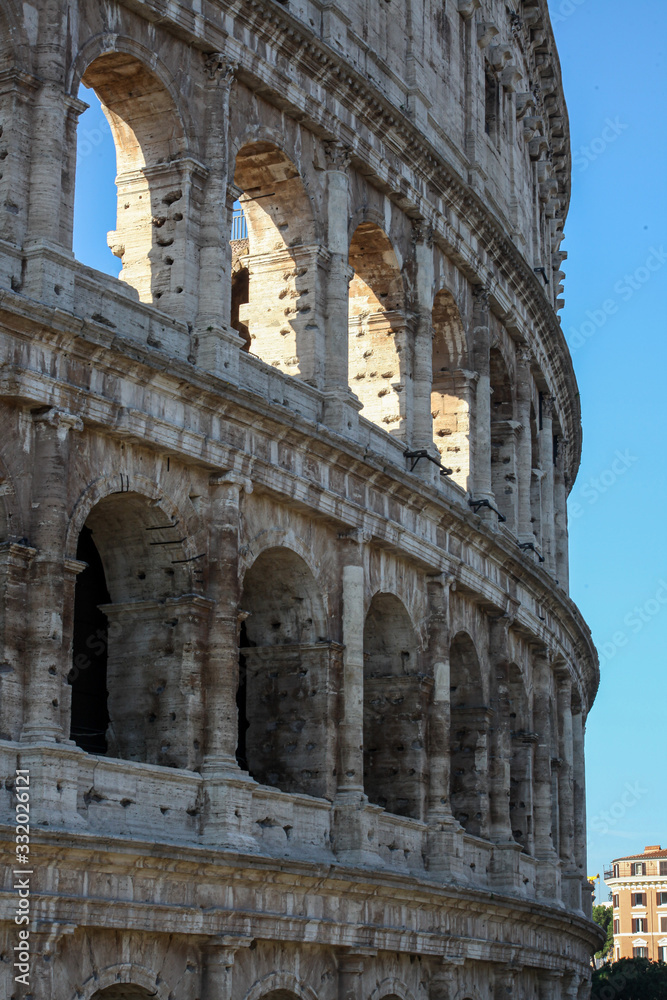 The Colosseum in Rome, Italy. Picturesque views of the ruins in summer.