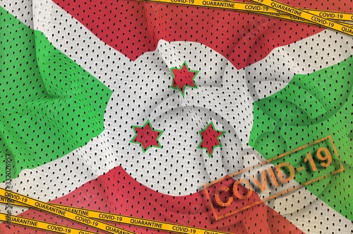 Burundi flag and Covid-19 biohazard symbol with quarantine orange tape and stamp. Coronavirus or 2019-nCov virus concept photo