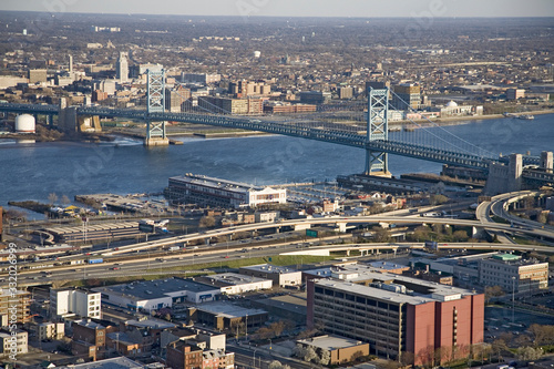 Aerial view of Ben Franklin bridge crossing the Delaware River from Philadelphia, Pennsylvania side into Camden New Jersey © spiritofamerica
