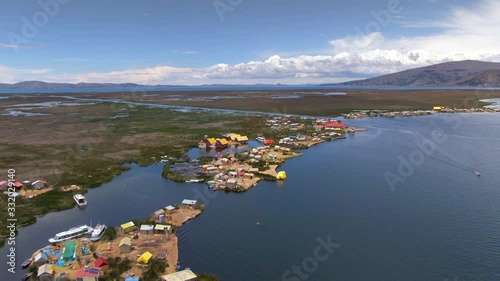 Aerial view of Uros Floating Islands (Spanish: Islas Uros ) on Lake Titicaca, the highest navigable lake in the world, near Puno, Peru, South America.