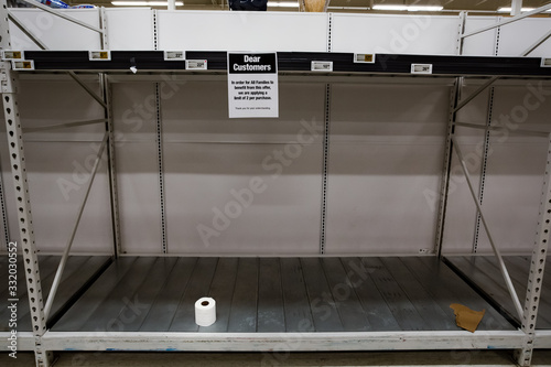 Фотография Panic buying hoarding concept related to the toilet paper shortage due to supply chain concerns related to the Coronavirus crisis