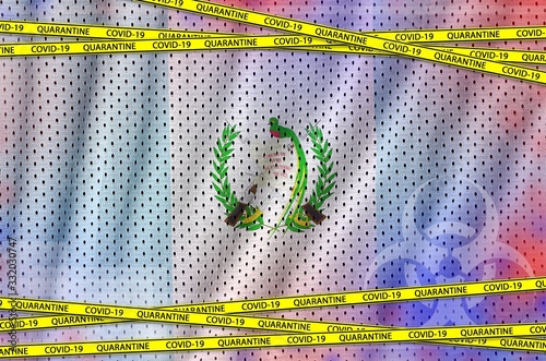 Guatemala flag and Covid-19 quarantine yellow tape. Coronavirus or 2019-nCov virus concept photo