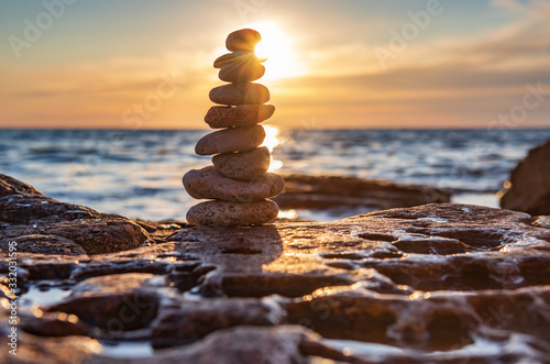 Zen concept. Sunset. The object of the stones on the beach at sunset.  Relax & Meditation. Zen stones.