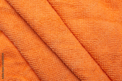 Orangeus microfiber tissue. Texture close up.