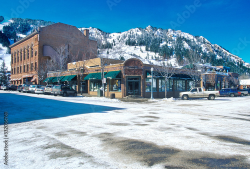 Storefronts and ski slope in the town of Aspen, Colorado photo