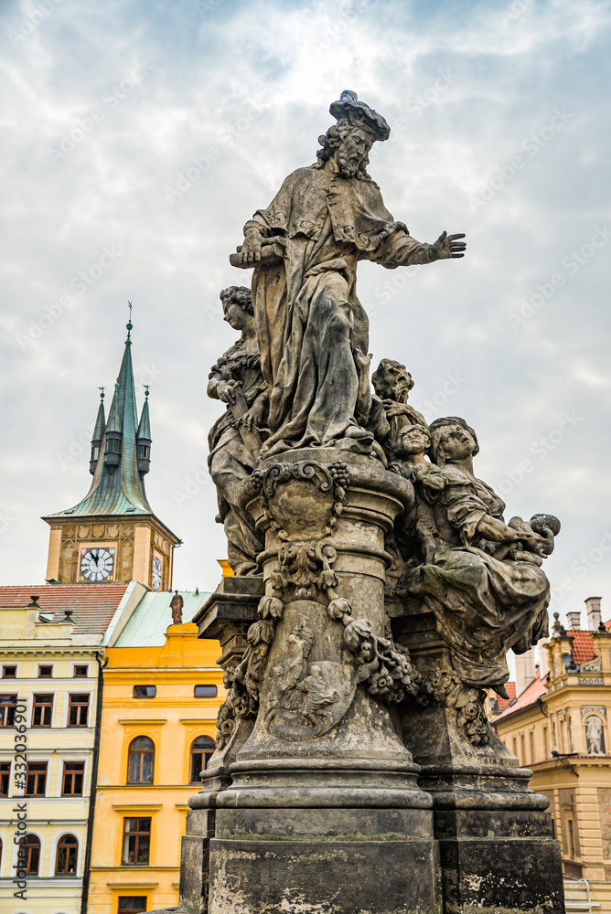 Prague, Czech republic - March 19, 2020. Statues of Charles Bridge without tourist during travel ban