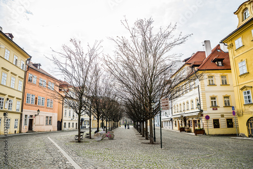 Prague, Czech republic - March 19, 2020. Street Na Kampe by Charles Bridge without tourists during coronavirus travel ban photo