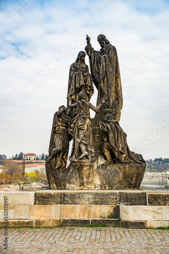 Prague, Czech republic - March 19, 2020. Statues of Charles Bridge without tourist during Covid-19 travel ban