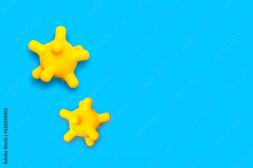 Φωτογραφία abstract yellow bacterium virus strain model of MERS-Cov on a blue background with copy space, pandemic protection concept mock up top view
