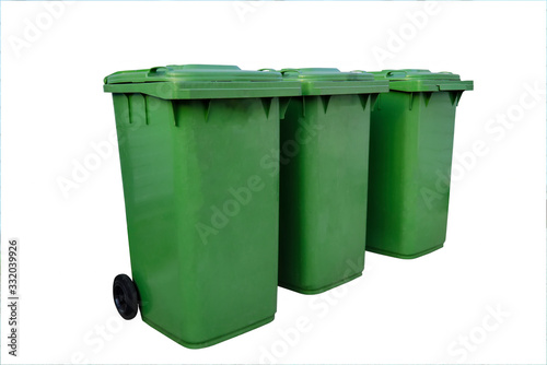 Green plastic trash recycling container close-up isolate on a white background.