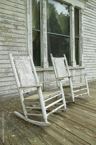 Billede på lærred Rocking chairs on porch of southern house in disrepair along Highway 22 in Centr