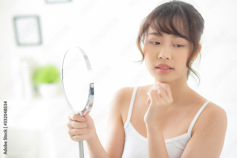 Beautiful face young asian woman with happy smiling and looking mirror, makeup of beauty facial girl with skincare and cosmetic treatment, refresh of female and clean for charming, healthy concept. Beautiful face young asian woman with happy smiling and looking mirror, makeup of beauty facial girl with skincare and cosmetic treatment, refresh of female and clean for charming, healthy concept.