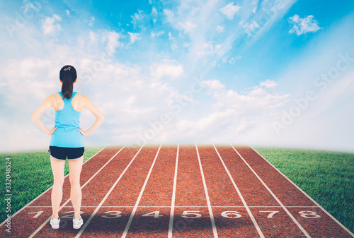 Back young asian woman start a run with track and nature background, girl runner ready to target success, healthy and care, exercise and workout, activity for wellness and lifestyle concept.