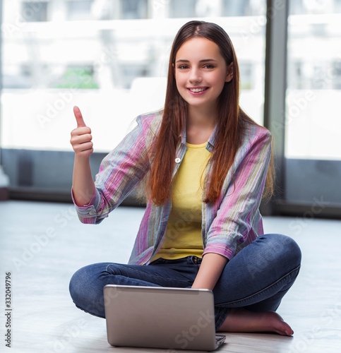 Young girl surfing internet on laptop Free Download Young girl surfing internet on laptop - GFXLoad