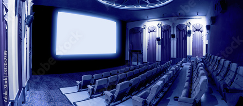 Cinema theater showing empty white movie screen. photo