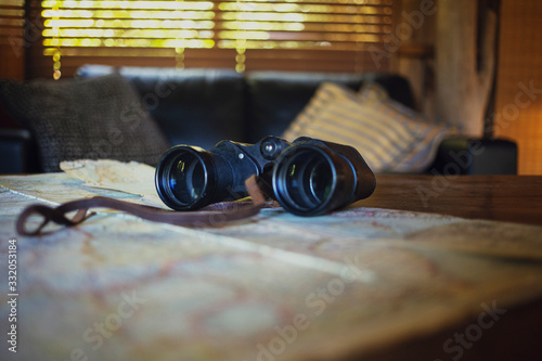 old map and binoculars