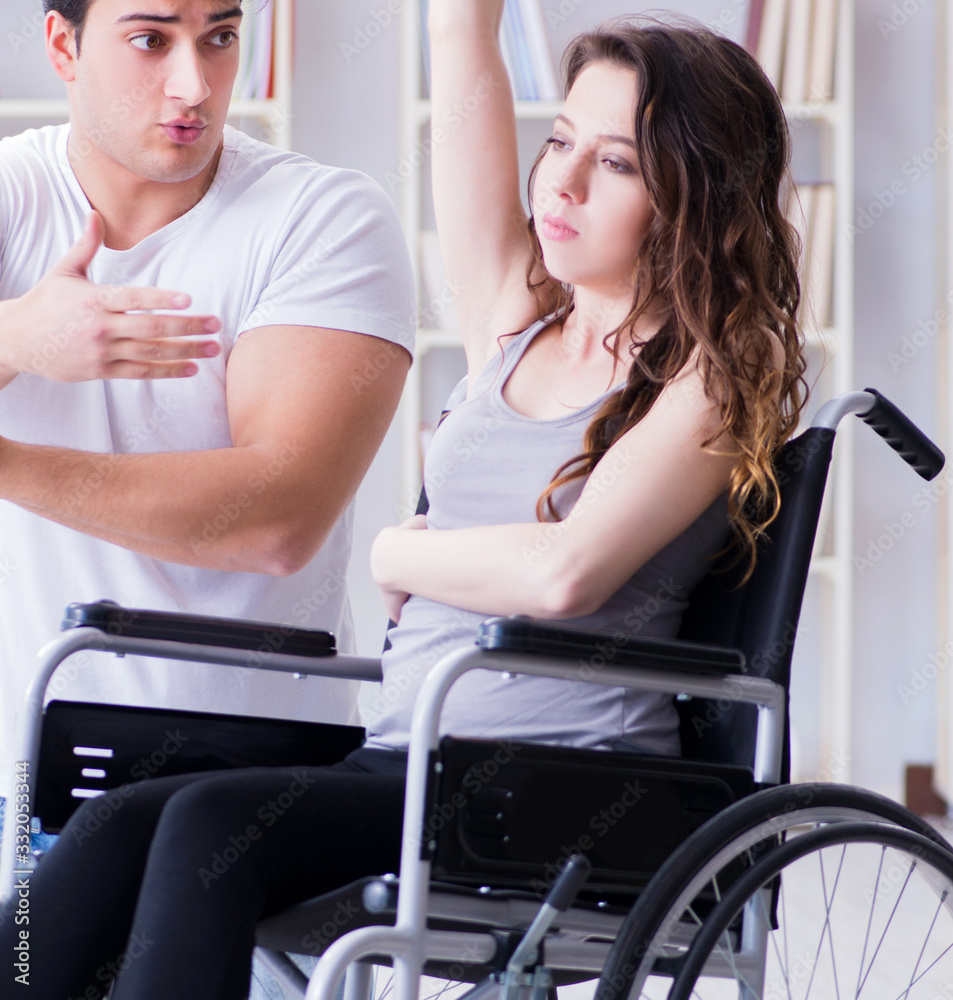 Patient undergoing rehabilitation recovery programme with doctor