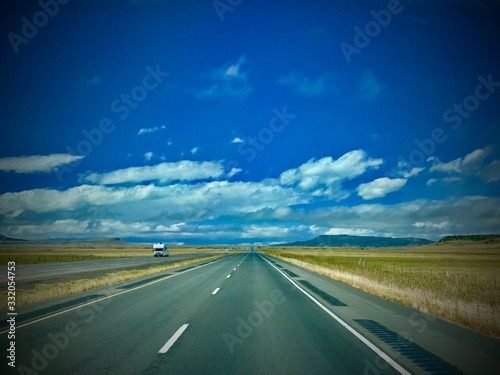long highway and blue sky